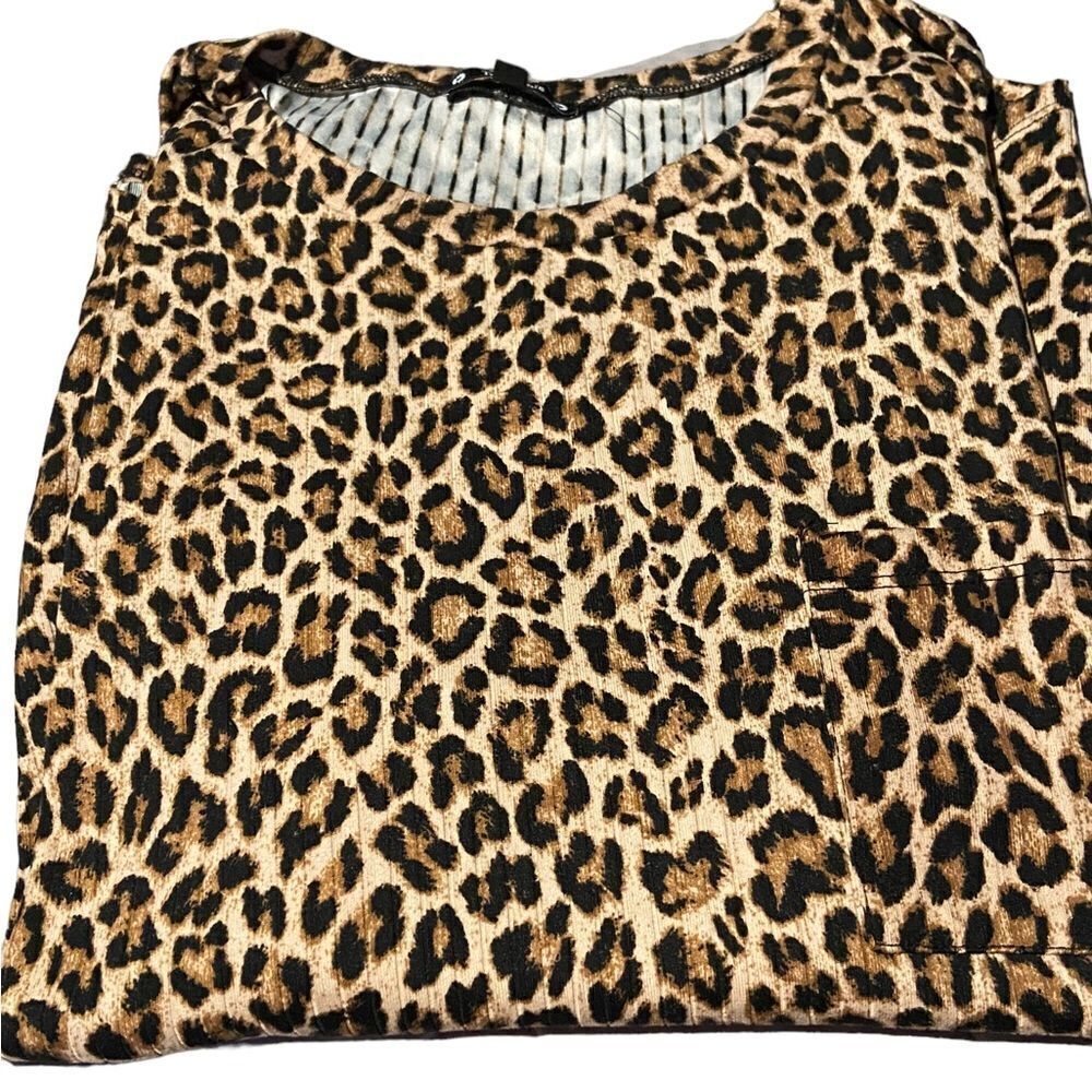 Try! This size 2X awesome leopard top cute pocket on right side great condition